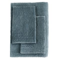 three blue towels folded on top of each other