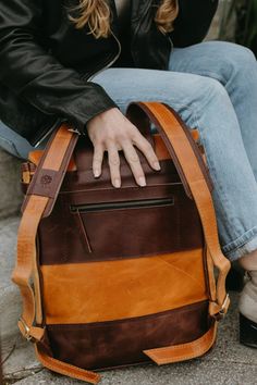 This Leather Backpack is the perfect way to travel for your meetings, work trips or everyday errands!Dimensions:14" W x 17" HFeatures:• Fits 13" laptop• Interior slots and zipper pocket• Exterior zipper pocket on back• Natural brass closures• Adjustable Leather straps Brown Backpack With Zipper Pocket For On-the-go, Laptop Backpack With Zipper Closure For Travel, Brown Laptop Backpack With Zipper Closure, Brown Leather Backpack With Zipper For Commuting, Travel Laptop Bag With Sleeve In Standard Backpack Shape, Everyday Laptop Backpack With Luggage Sleeve, Travel Laptop Bag With Laptop Sleeve, Laptop Backpack With Zipper For Trips, Brown Laptop Bag With Luggage Sleeve