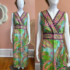 "Vibrant 70s handmade maxi dress. Dress has a colorful paisley/abstract print made up of pinks, blues and greens. The front is a criss cross top that cinches at the waist. Zips in back. Condition: Excellent/good - some light faded spots in dress but they do not detract from this beautiful dress! Measurements (approx.+ laid flat): Shoulder to shoulder:15.5\" Pit to pit:18\" Waist:16\" Hips:23\" Total length:54\" Follow us on IG for more shop updates @modern_m_vintage Check out our other listings: Green Lined Fitted Maxi Dress, Bohemian Fitted Spring Dresses, Bohemian Fitted Dresses For Spring, Fitted Bohemian Spring Dresses, Fitted Floral Print Dress With Empire Waist, Fitted Empire Waist Dress With Floral Print, Bohemian Fitted Floor-length Dress, Spring Paisley Print V-neck Maxi Dress, Spring V-neck Maxi Dress With Paisley Print