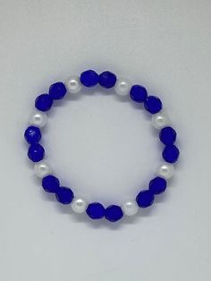 Elegant Sapphire Bracelets With Faceted Beads, Elegant Sapphire Bracelet With Faceted Beads, Adjustable Faceted Sapphire Bracelets, Adjustable Faceted Sapphire Bracelet, Elegant Adjustable Blue Crystal Bracelet, Elegant Blue Pearl Bracelet, Elegant Blue Round Pearl Bracelet, Elegant Blue Faceted Bracelets, Party Blue Crystal Bracelets