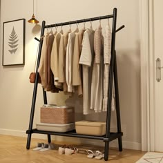 an iron rack with clothes and shoes on it