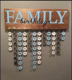 a wooden sign hanging from the side of a wall that says, family on it