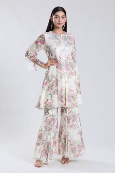 Off white bell sleeves kurta with all over bloomy print and sequin work on the yoke. Paired with a sharara. - Aza Fashions Long Sleeve Chanderi Sharara With Printed Motifs, Spring Salwar Kameez With Mirror Work And Long Sleeves, Spring Anarkali Set With Mirror Work And Straight Kurta, Spring Long Sleeve Salwar Kameez With Mirror Work, Spring Designer Anarkali Set With Mirror Work, White Printed Dresses For Eid, White Dress With Printed Motifs For Eid, White Dresses With Printed Motifs For Eid, Spring Sharara With Mirror Work And Straight Kurta