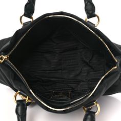 This is an authentic PRADA Tessuto Nylon Soft Calfskin Shopping Satchel in Black. This stylish satchel is crafted of black nylon fabric with black leather trim and gold-toned hardware. The bag features rolled leather top handles, faux buckle accents, adjustable side buckles, and a removable adjustable shoulder strap. The top zipper opens to a black Prada monogram jacquard interior with a zipper and patch pocket. Nylon Fabric, Black Nylon, Black Nylons, Leather Top, Leather Trim, Leather Trims, Patch Pocket, Calf Skin, Prada