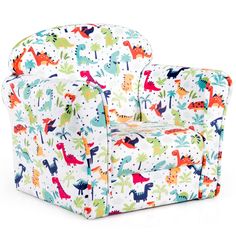 the children's chair is covered in colorful dinosaurs and stars on white fabric,