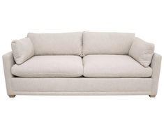 a white couch with two pillows on it