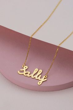 14k 18k 10k Solid Gold Minimal Gold Name Necklace, Custom Word Necklace, Personalized Name Jewelry for Women, Birthday Gift for Mom FEATURES• Solid Gold (real gold, not gold plated or gold filled material)• Gold Karat: 10K (417) - 14K (585) - 18K (750) (optional)• Pendant Height: 0.35 Inches (0.90 cm)• Pendant Width: depending on the text• Available Gold Color: Yellow gold, rose gold and white gold (optional)Wholesale requests are welcome.Our gold necklaces are perfect choice for a Christmas, Mo Classic Gold Name Necklace With Hallmark, Classic Gold Hallmark Name Necklace, Classic Name Necklace For Birthday, Classic Gold Hallmarked Name Necklace, Classic Name Necklace With Hallmark For Anniversary, Gold Hallmark Nameplate Necklace, Gold Nameplate Necklace With Hallmark, Classic Name Necklace With Hallmarks For Mother's Day, Gold Hallmarked Nameplate Necklace