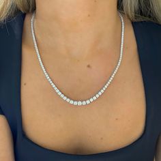 Heads are sure to turn when wearing this exquisite tapered diamond tennis necklace. This opulent arrangement of diamonds set in gold glistens beautifully against the skin. Metal: 14k White Gold / 14k Yellow Gold / 14k Rose Gold Round Brilliant Cut Natural Diamonds: Approx. 10.02 ctw G Color and SI1-2 Clarity Diamonds Length: 18 inches Closure: Box Clasp Looking for a different length? Please email us. Fine Jewelry Tennis Necklace With Diamond Cut Cubic Zirconia, Fine Jewelry Cubic Zirconia Tennis Necklace With Brilliant Cut, Fine Jewelry Tennis Necklace With Brilliant Cut Cubic Zirconia, Diamond White Tennis Necklace, Diamond White Cubic Zirconia Tennis Necklace, Fine Jewelry Tennis Necklace In Diamond White Cubic Zirconia, Fine Jewelry Tennis Necklace With Diamond Cut, Dazzling White Gold Tennis Necklace With Single Cut Diamonds, Diamond White Brilliant Cut Tennis Necklace