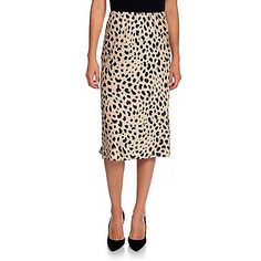 Skirt Color ChoicesLeopard - Shiny warm wheat brown undertone with true black spotsSkirt SizingFit: Form-fits through hipsHemline: Straight; lands near or below-the-kneeModel Notes: Model in Leopard is 5'7" with a 32" bust and 25" waist; wearing size XSSize Guide: View the Size Chart to determine your size and how to measureSkirt DetailsFabric Content: Made of 100% polyesterCare Instructions: Machine wash/Tumble dryCountry of Origin: ChinaPlease see the Garment Measurements tab for the actual me Elegant Leopard Print Summer Bottoms, Casual Leopard Print Midi Skirt Bottoms, Casual Leopard Print Midi Skirt, Chic Leopard Print Skirt For Spring, Chic Lined Pencil Skirt For Daywear, Flowy Leopard Print Skirt For Spring, Chic Midi Length Viscose Skirt, Chic Leopard Print Midi Skirt, Chic Flowy Leopard Print Skirt