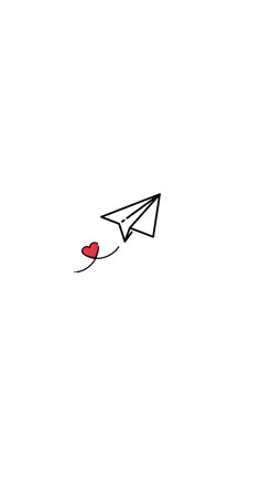 a paper airplane with a heart attached to it