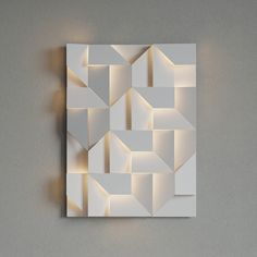 an abstract piece of art made out of white paper