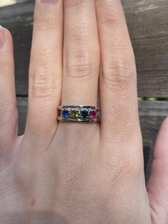 Total Weight: 3.8 grams Size: 7 Band Width: 3-6mm Sapphire: 3.75mm Emerald: 3.75mm Peridot: 3.75mm Spinel: 3.75mm Condition: In great condition showing little wear and no damage. All gold has been thoroughly checked with an Olympus RFK spectrometer. It is guaranteed 14k gold.  All our jewelry is properly washed and disinfected to ensure customers get clean items with every order.  Returns accepted but may be subjected to a restock fee.  Please message with any questions:) May Birthstone Multi-stone White Gold Jewelry, White Gold Multi-stone Jewelry For May Birthstone, Multi-stone Round Jewelry For May Birthstone, Heirloom Multicolor Jewelry With Accent Stones, Multicolor Multi-stone Emerald Cut Rings, Stackable Peridot Birthstone Ring For Anniversary, White Gold Multi-stone Rings For May Birthstone, Unique Multi-stone Birthstone Promise Ring, Fine Jewelry May Birthstone Multi-stone Ring