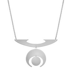 Jewelry with Meaning Space Jewelry - Futuristic Necklace DESIGNER'S NOTES: The geometry of this necklace represents the guardianship of our future. The circle symbolizes the seed of creation while the crescent acts as its protector. Both are suspended from a base, a metaphor of the preciousness and precariousness of our future. Key Features: Symbolic Design: Inspired by civilizations knowledgeable about the movement of the cosmos and the interwoven dependency of the elements, the Medicine Wheel Symbolic Metal Necklace With Moon Phase Detail, Symbolic Moon Phase Round Pendant Necklace, Symbolic Moon-shaped Metal Necklace, Symbolic Moon Shaped Metal Necklace, Crescent Amulet Necklace As Gift, Crescent Amulet Necklace As A Gift, Sterling Silver Crescent Amulet Necklace, Crescent Moon Phase Metal Necklace, Symbolic Crescent Moon Phase Necklace