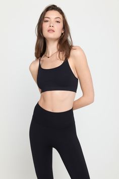 Seamless transition. A minimal support bra with adjustable straps, designed with an interior layer bra and back keyhole design. Made in our Seamless Rib fabric with intentionally placed compression zones and 4-way stretch, it is compressive and soft. | Tatum Seamless Bra in Black Functional Compressive Crop Top With Built-in Bra, Micro-elastic Crop Top With Built-in Bra For Yoga, Compressive Seamless Sports Bra With Built-in Bra, Athleisure Bra With Removable Pads And Compressive Fit, Compressive Functional Bra With Removable Pads, Compressive Athleisure Bra With Removable Pads, Compressive Full Coverage Sports Bra With Built-in Bra, Modern Stretch Sports Bra With Built-in Bra, Stretch Nursing Bra With Seamless Construction For Workout