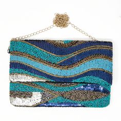 There's no chance you'll experience the blues when you're carrying this clutch. It reminds us of the waves of the ocean and no one has the blues staring at the beach 😎 12 in x 8 in Blue & Gold bead & sequin embellishments Black canvas backing and lining Blue Sequin Evening Bags, Blue Beaded Evening Bag For Party, Blue Rectangular Summer Clutch, Rectangular Blue Beaded Clutch, Embellished Blue Party Clutch, Blue Embellished Party Clutch, Blue Beaded Clutch Bag, Blue Beaded Party Bag, Blue Beaded Clutch Evening Bag