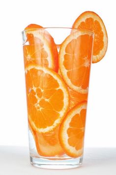 an orange slice in a glass with water