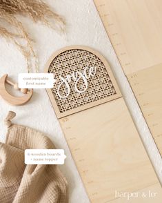 a wooden bookmark with the word monogrammed on it next to other items