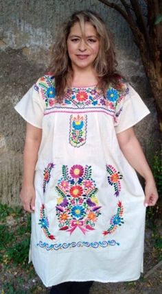 Beautiful and cool Mexican embroidered dress, with a chic touch, ideal to look at the beach, themed events, cool, comfortable and elegant Mexican huipil. Boho dress sizes 2XL BUST 54 INCHES HIPS 56 INCHES Long 42 inches Size 4XL Bust 58 inches Waist 66 inches Length 42 inches The wonderful thing about this dress model is its comfort and elegance. Ideal for women of any age. It has no age exclusivity. Every woman looks beautiful in this type of dress. It is a cheerful dress, cool, suitable for any occasion. It has beautiful embroidered colors. I love working with the blanket, it is fresh and comfortable, the embroidered is combined with beautiful colors. Casual Embroidered Boho Dress For Vacation, Summer Short Sleeve Dress With Geometric Embroidery, Short Sleeve Dresses With Geometric Embroidery For Summer, Summer Dresses With Geometric Embroidery And Short Sleeves, Short Sleeve Embroidered Dress With Geometric Patterns For Summer, Multicolor Embroidered Short Sleeve Summer Dress, Summer Short Sleeve Embroidered Dress With Multicolor Embroidery, Summer Embroidered Dress With Multicolor Embroidery And Short Sleeves, Casual Embroidered Boho Dress For Beach