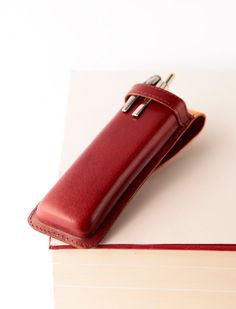 "Fountain pen case for men. Vintage pen case. Pencil case. SPECIFICATIONS: The case measures approximately: - Length: .17cm (6,8\") - Width: 5,5cm (2,2\") - Height: 1,6cm (1,1\") (Pens are not included.) This finely crafted leather pen case is a sophisticated & functional accessory to carry your favorite pens. Handmade with natural vegetable tanned leather. This case is wet-formed to precisely fit desired shape. The leather, once wet formed and dried, becomes very stiff providing an extra me Rectangular Pencil Case With Pen Slots, Leather Pencil Case With Pen Slots For School, Red Rectangular Pencil Case With Pen Holders, Rectangular Red Pencil Case With Pen Holders, Everyday Pencil Case With Pen Slots, Classic Rectangular Pencil Case For Personal Use, Leather Cases With Pen Slots For Daily Use, Classic Leather Pencil Case For Personal Use, Rectangular Pen Holder Case For Daily Use