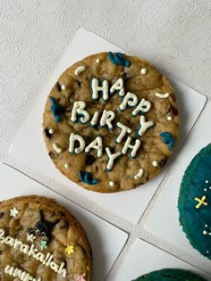 three cookies with happy birthday written on them