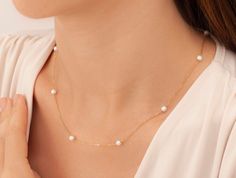 "14k Gold Pearl Necklace, Dainty Pearl Necklace, Dainty Freshwater Pearl Necklace, Bridesmaid Gifts, Pearl Jewelry, Gold Pearl Necklace * Material: High Quality 925 Sterling Silver, 14k Solid Gold, 8K Solid Gold ( you can choice it on material menu) H O W ∙ T O ∙ O R D E R - Select options from the drop-down menu - Add to cart and proceed to checkout The silver pearl necklace in the photo is the one that you will be purchasing.  Necklace will be shipped in an elegant gift box for no extra charge. C A R E ∙ I N S T R U C T I O N S Although our jewelry are high quality with extra layers of coat for long lasting, yet plated jewelry should be cleaned periodically. To extend the life of your jewelry, it's very important that you keep it dry (never bathe or spray perfume on your jewelry, chemica Yellow Gold Single Strand Necklace For Wedding, Delicate Single Strand Necklace For Anniversary, Delicate Single Strand Necklaces For Formal Occasions, Delicate Single Strand Necklace For Formal Occasions, Delicate Single Strand Jewelry For Anniversary, Fine Jewelry Bridal Necklace As Gift, Delicate Necklace For Anniversary, Anniversary Pearl Chain Necklace, Gift Yellow Gold Pearl Necklace