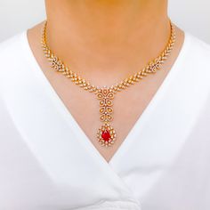 Make a statement with this Intricate Floral Ruby Diamond Set. Crafted from 18k yellow gold, this set features sparkling diamonds with a total weight of 8.34 carats, and exquisite pear-shaped rubies. The interchangeable stones allow for versatility, while the 16.75" set length and 2.25" drop length provide a striking look. Matching screw-back earrings complete the set. PRODUCT DETAILS Gold Purity(karat): 18k Item Weight(grams): 62.8 Item Finish: Yellow Gold Stone: Diamond Diamond Weight(carats): Luxury Ruby Diamond Necklace With Diamond Accents, Luxury Ruby Diamond Necklace With Accents, Formal Bridal Necklace In Yellow Gold With Gemstone, Formal Yellow Gold Bridal Necklace With Gemstone, Luxury Ruby Bridal Necklace, Formal Red Diamond Necklace With 17 Jewels, Elegant 22k Gold Red Jewelry, Elegant Red 22k Gold Jewelry, Luxury Ruby Diamond Necklace