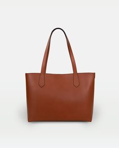 The Elba is a medium size structured tote, crafted from certified Italian vegetable-tanned leather. It is classic yet practical. Matched with detachable wristlet pouch, lending a sophisticated aesthetic when used solo, while providing easy access to your most crucial items when placed in your Elba Tote. It comes with Dust bag and Gift box MADE IN ITALY - All our materials are produced and sourced locally in Italy Minimalist Tote, Italian Vegetables, Wristlet Pouch, Sophisticated Aesthetic, Aging Beautifully, Wristlet Wallet, Elba, Shopper Bag, Golden Brown