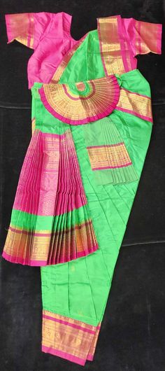 Bring the beauty of Bharatnatyam to life with this ready-made dance costume. Crafted with high-quality fabrics, this costume will provide superior comfort and confidence while you perform. It's the perfect addition to any dancer's wardrobe. Material: Dharmavaram Silk Saree Size: 34/36/38/40 - Height from Waist to Ankle Bone Age: 14+ Years Bharatanatyam Costume Designs, Sri Lankan Dance Costumes, Bharatanatyam Costume Colors, Bharatanatyam Skirt Costume, Green Bharatanatyam Costume, Ankle Bones, Dance Costumes, Silk Sarees, Quality Fabric