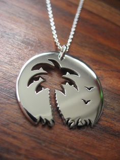 Palm tree Sunset Birds Pendant Necklace on Etsy, $65.18 Laser Engraved Sterling Silver Jewelry, Laser Engraved Sterling Silver Necklace, Sterling Silver Pendant Necklace With Laser Engraving, Sterling Silver Laser Engraved Pendant, Laser Engraved Sterling Silver Pendant, Beach Palm Tree Tattoo, Tree Leaves Tattoo, Leaves Tattoo, Palm Tree Necklace