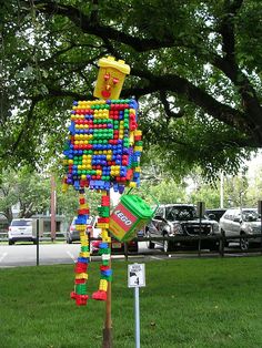 a sculpture made out of legos in the grass