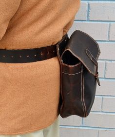 "The pouch is oil tanned leather bird bag includes leather 1 3/4\" inch wide belt with 1 3/4\" solid brass belt buckle. The belt fits waist sizes 34\" - 46\". Bag is attached with Chicago screws allowing complete versatility in removing each pouch to your liking. The center bird bag is lined with 100% nylon fabric for ease of cleaning. Material: Oil Tanned Leather Hardware: Antique Brass Outside Dimensions: Bird Bag - 9.5\" W x 9 1/4 \" H x 3\" D Shells Bag - 8.5\" W x 8 \" H x 3\" D Belt - 46 \ Vintage Belts And Suspenders For Everyday Use, Brown Belt With Brass Hardware For Everyday, Everyday Leather Belts With Brass Hardware, Leather Belt Buckles With Removable Belt For Everyday Use, Leather Belt Buckle With Removable Belt For Everyday Use, Vintage Belts And Suspenders With Removable Belt, Leather Belt Buckles With Brass Buckle For Everyday, Chicago Screws, High Point Nc