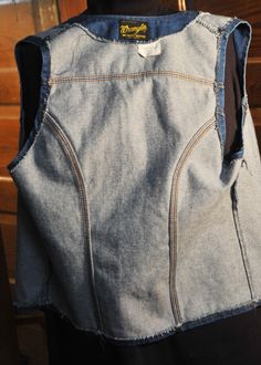 "This is a 1960s Blue Jean Wrangler Denim Vest. It is 100% Cotton made in the USA It has a classic Vintage design with 2 patch pockets and the Wrangler Rope Logo on the label. It is in Excellent Vintage Condition. The vest has metal signed buttons It is marked medium I think this means a 60's Medium which would be a bit tight now. So I'm calling it a Man's S and a Woman's Medium Please check measurements. Across shoulders at back - 12\" Across the chest at bottom of armpit holes - 18\" (X2) Coll Cotton Denim Jacket With Pockets For Rodeo, Vintage Cotton Denim Jacket For Rodeo, Mechanic Coveralls, Western Suits, Reversible Vest, Memphis Tn, Old Clothes, Have Metal, Wool Vest