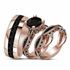 two rose gold wedding rings with black diamonds on each band and an oval diamond in the center