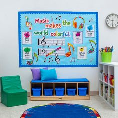 there is a blue wall with music notes on it in the room next to a green chair