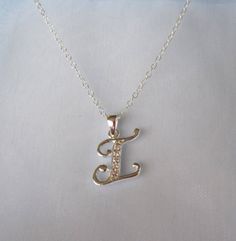 925 sterling silver Monogram INITIAL LETTER I with cz stones personalized charm with chain necklace.Pendant and chain - 925 sterling silver (hallmarked). Please choose the length of the chain from the menu.The pendant (without the bail) is 14mm x 12mm (0.55" x 0.47").The necklace comes bubble wrapped and gift wrapped in a complementary organza bag. Silver Cubic Zirconia Pendant Name Necklace, Silver Cubic Zirconia Initial Necklace For Gift, Silver Cubic Zirconia Pendant Necklace, Personalized Silver Initial Necklace With Cubic Zirconia, Silver Cubic Zirconia Initial Necklace, Personalized Silver Cubic Zirconia Charm Necklaces, Sterling Silver Initial Necklace With Name, Silver Cubic Zirconia Initial Pendant Necklace, Silver Initial Pendant Name Necklace For Anniversary