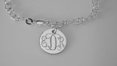 "This lovely sterling silver bracelet features a 17 gauge, high polish sterling silver 1/2\" diameter disc on a sterling silver 7\" chain, with a lobster claw clasp. I can engrave a monogram, one to three initials, or a name, date or word up to 10 characters. The back of the disc can also be engraved with up to 10 characters The bracelet will be delivered to you in a gift box. This style is also available in 8\" Length: https://www.etsy.com/listing/950524673/custom-engraved-monogram-or-initial? Gift Sterling Silver Link Bracelet With Polished Finish, Classic Silver Name Bracelet With Polished Finish, Classic Engraved Sterling Silver Charm Bracelet, Classic Personalized Name Bracelet, Adjustable Link Charm Bracelet In Sterling Silver, Adjustable Sterling Silver Link Charm Bracelet, Adjustable Link Sterling Silver Charm Bracelet, Personalized Sterling Silver Link Jewelry, Adjustable Silver Name Bracelet With Polished Finish