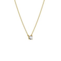 a gold necklace with a small white diamond on the front and back of it's chain