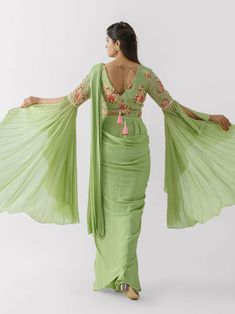 Green Silk Pre-draped Saree, Green Georgette Draped Saree, Green Pre-draped Saree For Reception, Green Draped Lehenga With Cutdana, Green Draped Georgette Dress, Green Pre-draped Saree With Dupatta, Green Draped Silk Sets, Green Draped Saree For Wedding, Green Draped Saree With Unstitched Blouse