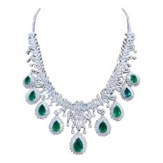 A true piece of art. The intricate design, meticulous craftsmanship, and flawless finishing combine to create a stunning piece that is not only beautiful , but also a work of art , absolutely sophisticated and impressive design. Every detail has been carefully considered, making it a masterpiece of jewelry . Magnificent necklace come in 18k gold with 9 pieces of Natural Zambian Emeralds, spectacular vivid green, extra fine quality and grade , in perfect pear cut, of 25,80 carats, and 1202 piece Opulent Round Necklaces For Formal Occasions, Opulent Formal Necklaces With 17 Jewels, Exquisite Jeweled Emerald Necklace For Anniversary, Luxury Hand Set Emerald Necklaces, Luxury Hand-set Emerald Necklaces, Luxury Teardrop Emerald Necklace With 17 Jewels, Green Diamond Necklace For Formal Occasions, Opulent Formal Necklace With Elegant Design, Pear-shaped Emerald Necklace For Formal Events