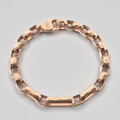 Designed and crafted with timeless elegance in the heart of Italy, this men's bracelet is a masterpiece of artisanal craftsmanship. Each link of the bracelet is forged from the finest 14k or 18k gold, meticulously faceted and hammered to create a unique texture that reflects the light with a captivating brilliance. The hammered effect, a hallmark of Italian craftsmanship, gives the bracelet a rugged yet refined appearance, blending tradition with modern sophistication. Material : 14k or 18k Gold Gold Bracelets For Men Unique, Neutral Jewelry, Mens Bracelet Silver, Jeweled Earrings, Gold Armband, Mens Gold Bracelets, Italian Craftsmanship, Italian Jewelry, Men's Bracelet