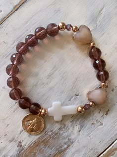 Such a beautiful decade rosary bracelet with rose gold and sparkling crystal! Gold filled Virgin Mary Medal and mother of pearl cross Leather Jewelry Bracelet, Rosary Jewelry, Decade Rosary, Prayer Bracelet, Catholic Jewelry, Rosary Bracelet, Beads Bracelet Design, Christian Jewelry, Cross Bracelet