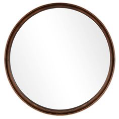 a round mirror on a white wall with wood trim around the edges and an oval wooden frame