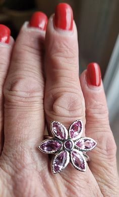 Our 14k white gold pink tourmaline birth flower ring is a birthstone ring & statement ring in one. This is a custom designed ring, which means it is one of a kind design. We love the floral theme in jewelry, as it is the ultimate in femininity, while being fun! Floral jewelry always makes me smile. We used 6 Marquise shaped gemstones for the petals and the center is a 3mm round gemstone. All gems are bezel set for stone security. The metal outlining the petals is given detail by hand. Let us mak Fine Jewelry Flower-shaped Gemstone, Fine Jewelry Flower-shaped Multi-stone Rings, Multi-stone Flower Ring Fine Jewelry, Luxury Pink Flower-shaped Ring, Pink Gemstone Flower-shaped Jewelry, Custom Ring Designs, All Gems, Floral Jewelry, Floral Theme