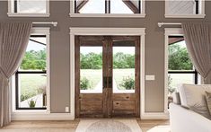 a living room filled with furniture and two large doors leading to a covered patio area