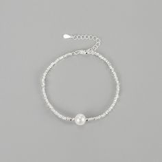 Elevate your wrist with our stunning Natural Pearl Sterling Silver Bracelet. Crafted with genuine pearls and high-quality sterling silver, this bracelet exudes elegance and sophistication. The natural pearls add a touch of luxury, making it a perfect accessory for special occasions or everyday wear. Embrace timeless beauty with this exquisite bracelet that will effortlessly enhance your style. Material: 925 Sterling Silver Stone: 8mm Natural Freshwater Pearl Length: 16+3cm Silver Dainty Pearl Bangle Bracelet, Elegant Silver Beaded Jubilee Bracelet, Adjustable Sterling Silver Pearl Charm Bracelet, Sterling Silver Beaded Bracelets With Pearl Charm, Silver Pearl Bracelets With Pearl Chain, Silver Pearl Bracelet With Pearl Charm For Party, Silver Bracelet With Pearl Charm For Party, Silver Sterling Bracelets With Pearl Chain, Silver Bracelets With Pearl Charm For Party