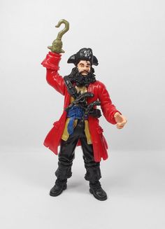 a toy pirate with a hook in his hand