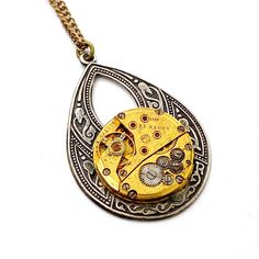 Helen, Watch Movement Necklace Steampunk Necklace Movement may vary slightly The necklace is approximately 2" x 1.5" and comes on a 16" chain - chain can be requested in any lengthen. Vintage Stainless Steel Chain Necklace, Steampunk Style Metal Necklace With Adjustable Chain, Steampunk Metal Necklace With Adjustable Chain, Steampunk Necklace With Adjustable Metal Chain, Vintage Gold Pocket Watch In Stainless Steel, Vintage Stainless Steel Pendant Jewelry, Vintage Medallion Stainless Steel Necklaces, Vintage Stainless Steel Medallion Necklace, Vintage Medallion Stainless Steel Necklace