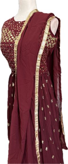 Step out in style with our Elegant Maroon Lehenga Choli, perfect for any special occasion. This beautiful ensemble is made from high-quality georgette fabric that is comfortable to wear, ensuring you look and feel amazing all day long. The sleeveless blouse features lovely mirror and embroidery work, adding a touch of glamour to the outfit. The flattering skirt is made of crushed fabric with layers and cancan inside, giving it the perfect amount of volume and movement. Suitable for parties, weddings, get-togethers, and all festive occasions, this stunning Lehenga Choli also makes a great gift. Complete with a matching dupatta, this outfit is sure to turn heads wherever you go.   Suitable for any festive occasions, weddings, parties, celebrations, and get-togethers. Comes with a lovely dupa Maroon Lehenga Choli, Blouse With Skirt, Lehenga Choli For Wedding, Lehenga Choli Designer, Choli For Wedding, Maroon Lehenga, Indian Lehenga Choli, Bollywood Lehenga, Net Lehenga