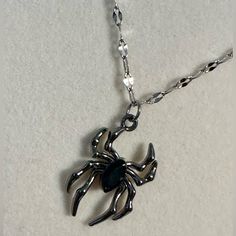 Black And Silver Tone Spider Charm On A Silver Tone Stainless Steel Chain. *Brand New. *Silver And Black Tone. *Stainless Steel Chain. *Aluminum Zinc Alloy Charm. *Unisex, Women, Men, Boys, Girls. Silver Jewelry For Halloween Alternative Fashion, Punk Black Jewelry With Silver Chain, Black Emo Jewelry With Adjustable Chain, Punk Style Black Necklace For Gift, Nickel-free Silver Jewelry For Alternative Fashion, Gothic Silver Necklaces Nickel-free, Gothic Silver Nickel-free Necklaces, Black Metal Necklaces With Lobster Clasp, Silver Punk Jewelry For Halloween