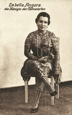 an old photo of a woman sitting in a chair